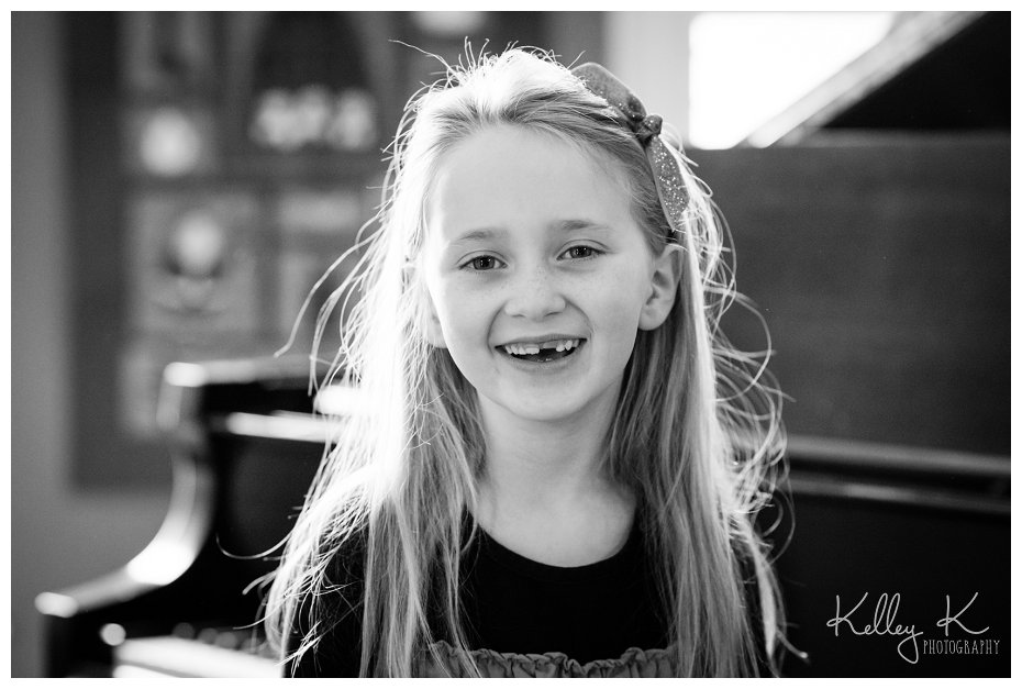 Child in front of piano | Kelley K Photography - Smyrna