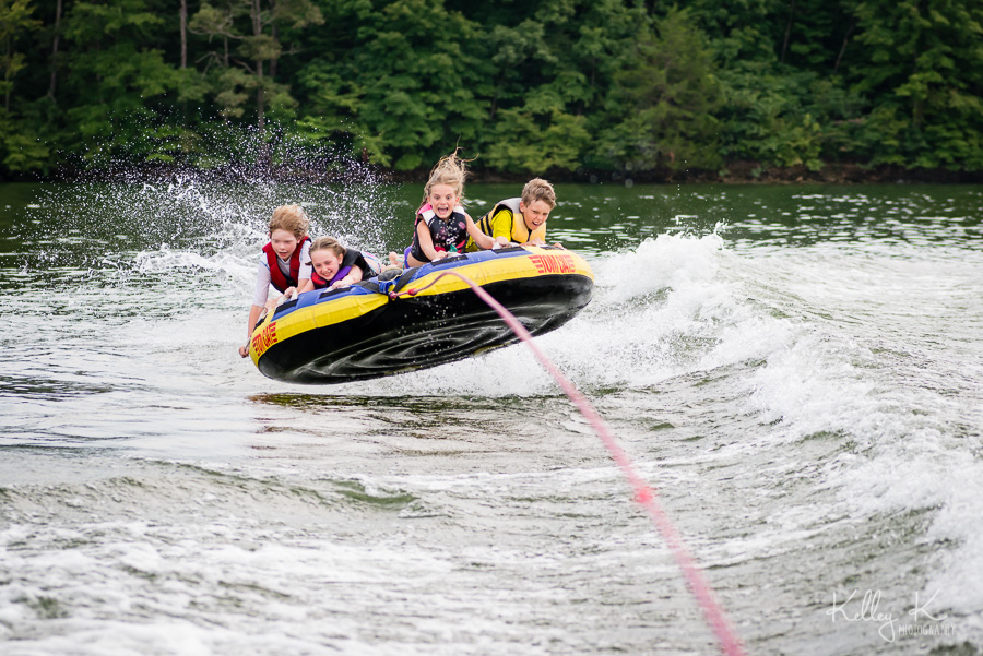Kids-tubing-getting-air-KelleyKPhotography-SmyrnaGA