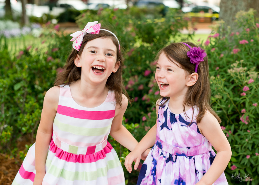 Spring portrait of two sisters laughing